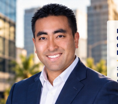 John Ishikawa in a navy business suit